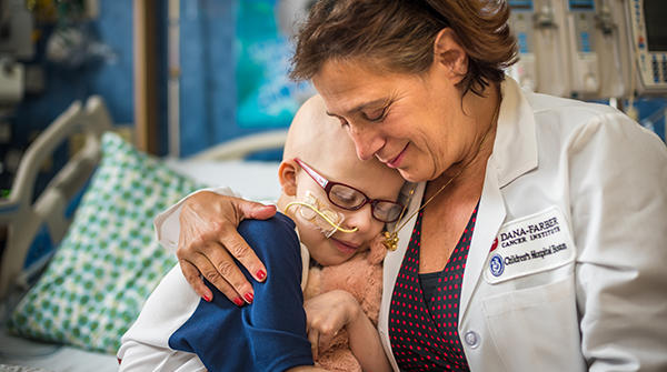 Leslie Lehmann, MD, with a pediatric patient