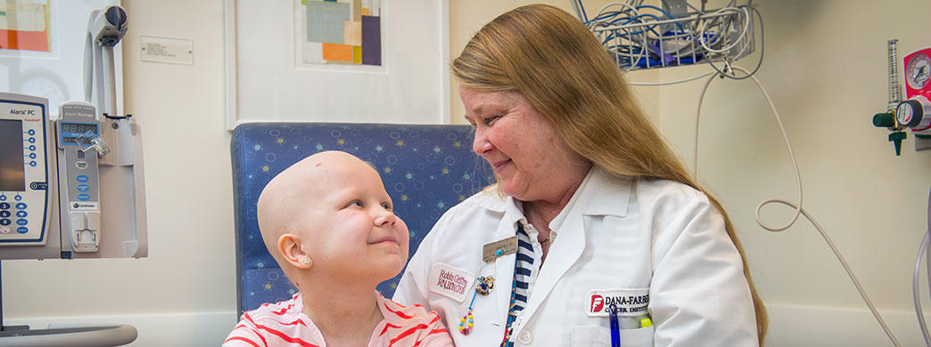 nurse with a pediatric patient